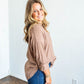 loose fit long sleeve shirt with v neck collar and drop sleeve