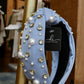 thick blue knotted headband with pearl and jewel detailing