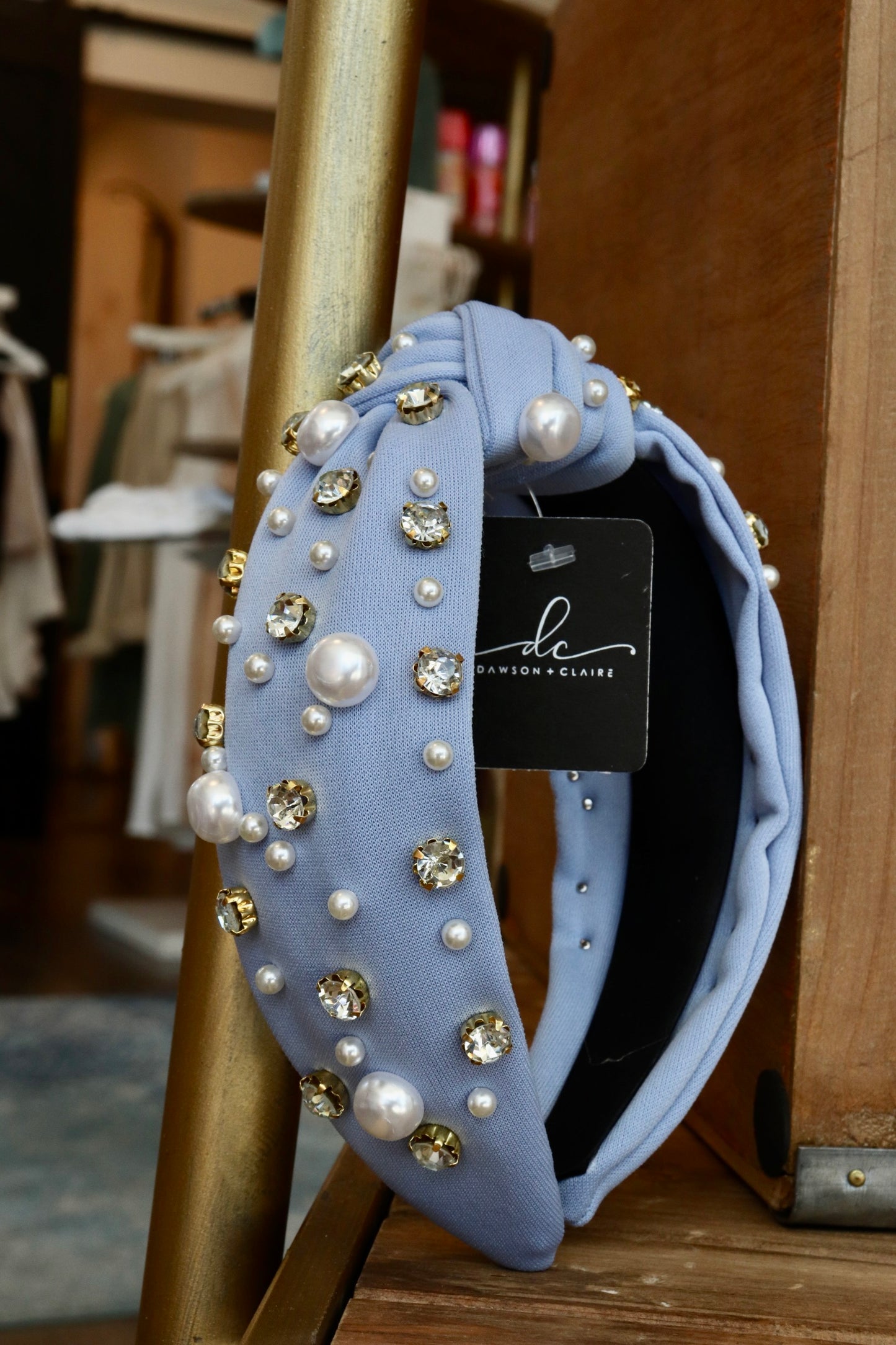 thick blue knotted headband with pearl and jewel detailing