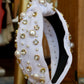 thick white knotted headband with pearl and jewel detailing